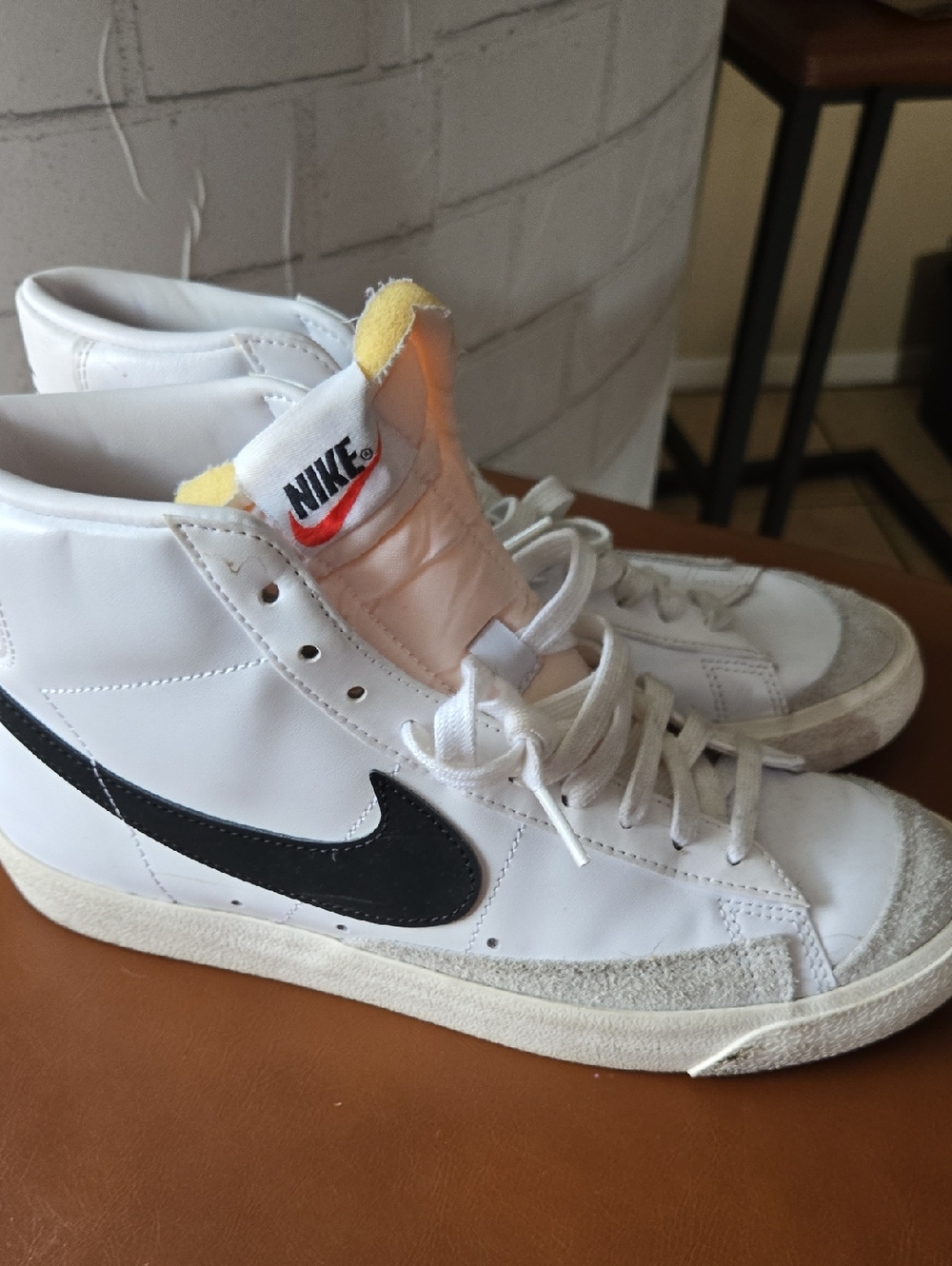Nike White High-Top BLAZER Sneakers with Black Swoosh and Yellow Tongue Detail